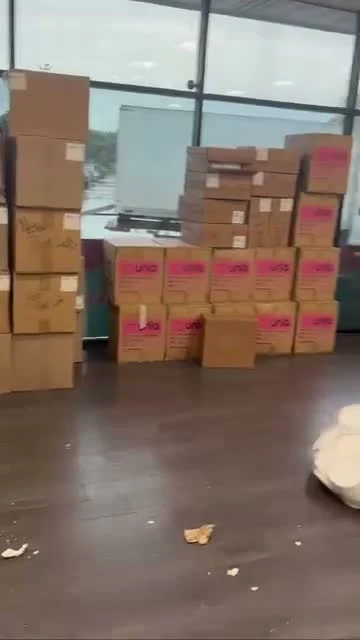 Frame from Rasaan's video showing boxes inside a shop before cleanout