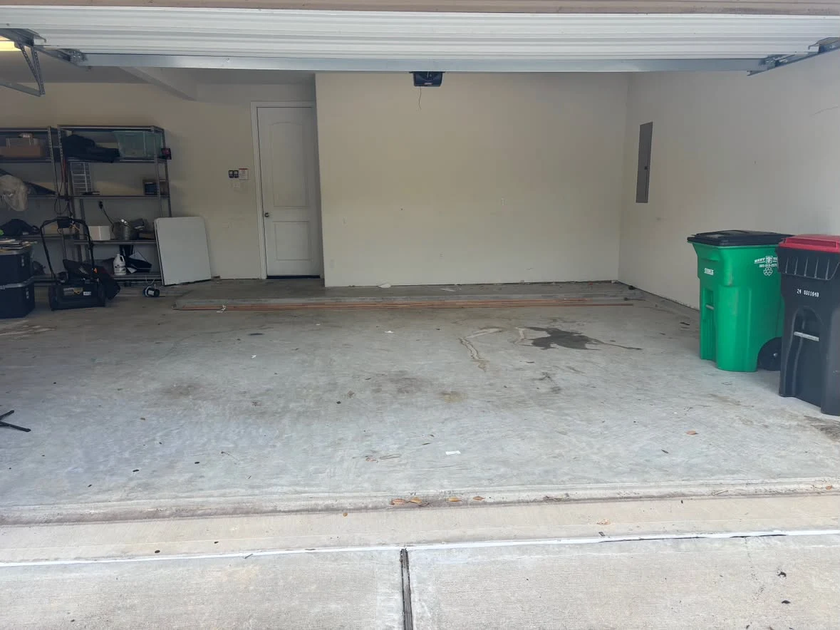 Cleared garage floor after 005 Haul's cleanout